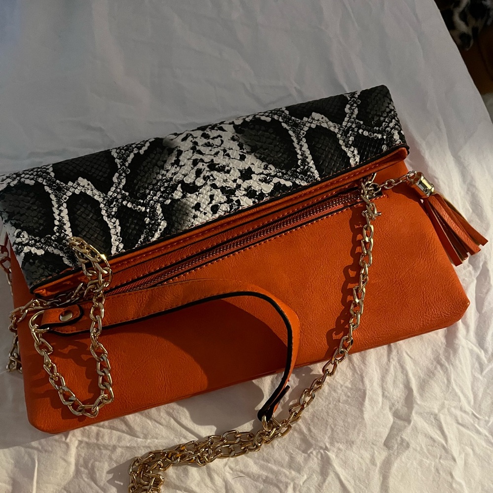 Orange purse snake skin fold over